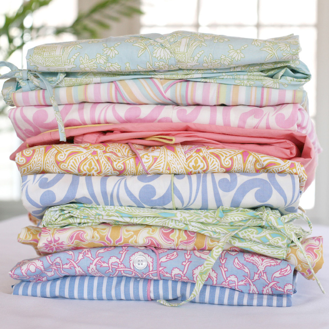 Colorful women's pajamas folded in a stack.